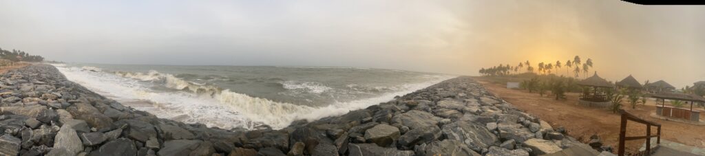 Waves crash on the seawall as the sun sets at Lemon Beach Resort